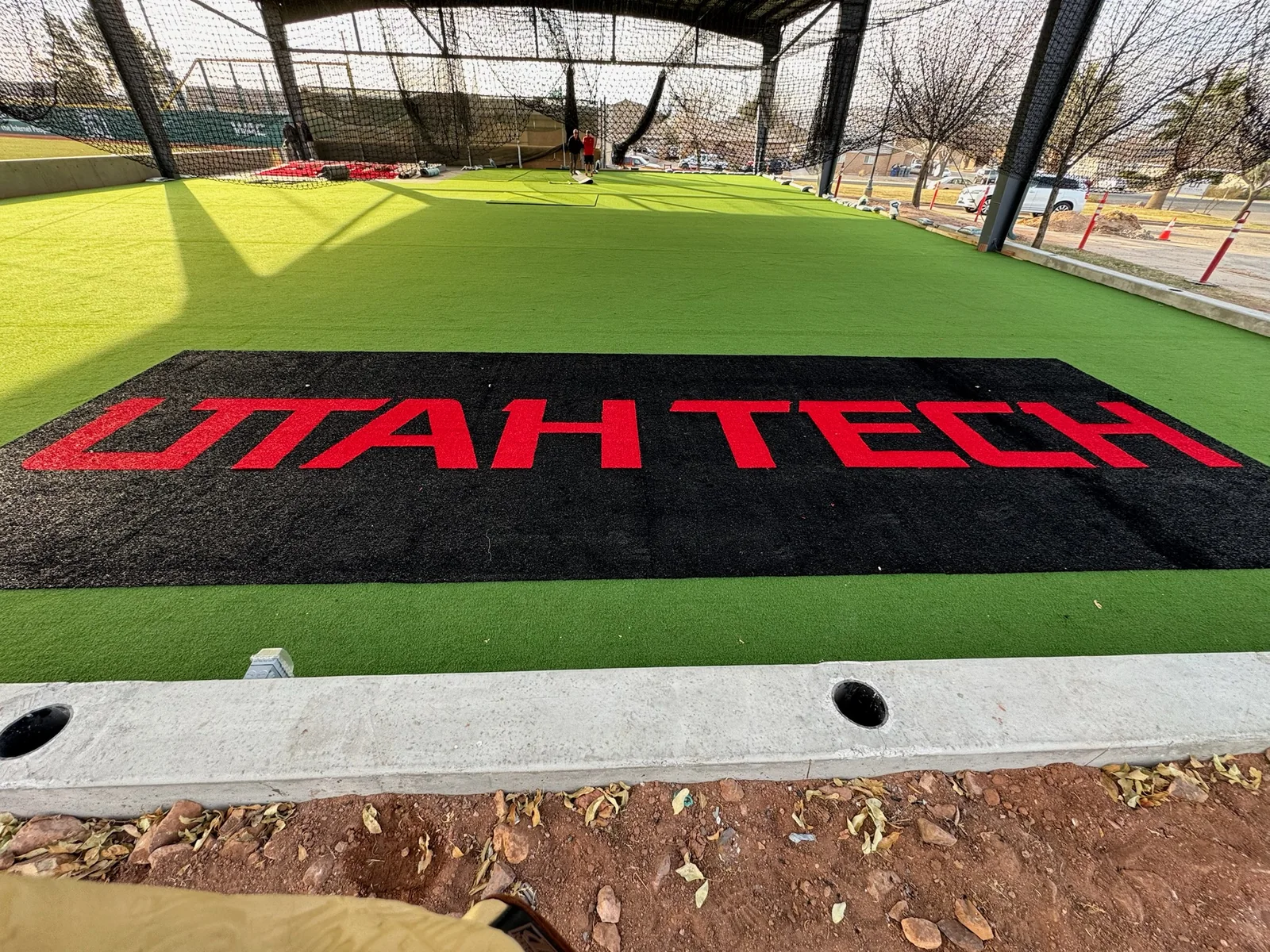 UTAH TECH wordmark inlaid into the batting cage turf